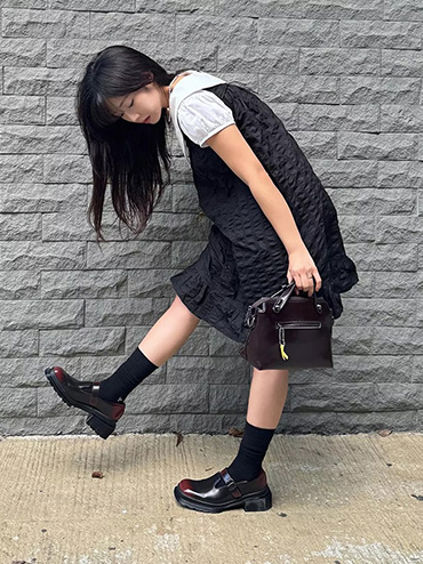 Girl in Dr. Martens boots