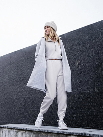 Woman in Vuori Trench Coat