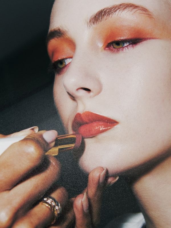 Woman putting makeup on