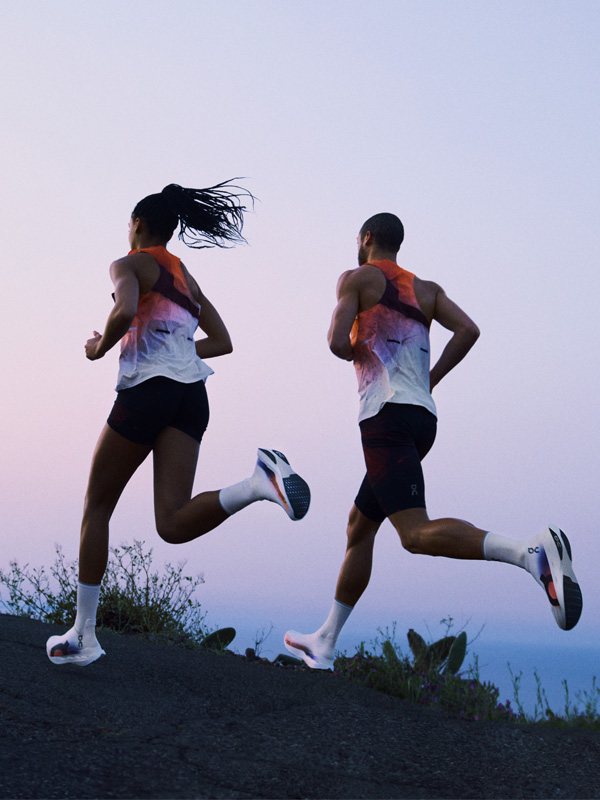 Man and woman running in ON attire