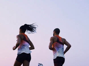 Man and woman running in ON attire