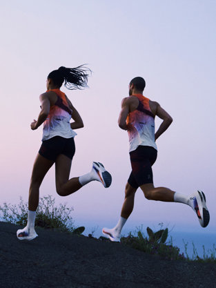 Man and woman running in ON attire
