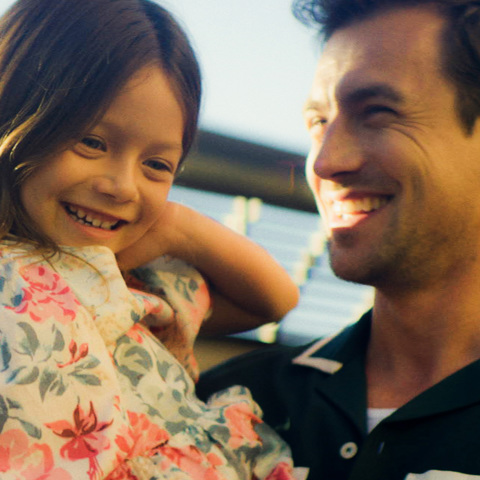 Father and daughter near koi pond at Fashion Island