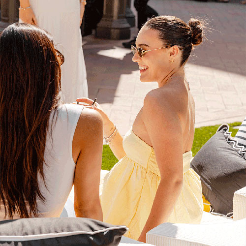 Woman in yellow dress at Live on the Lawn at Fashion Island